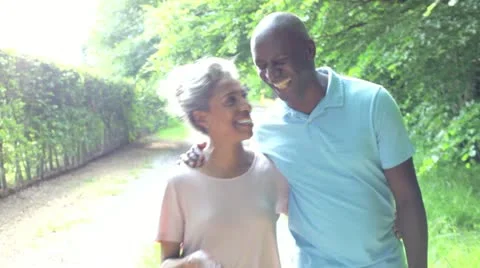 Mature African American Couple Walking In Countryside Stock Footage