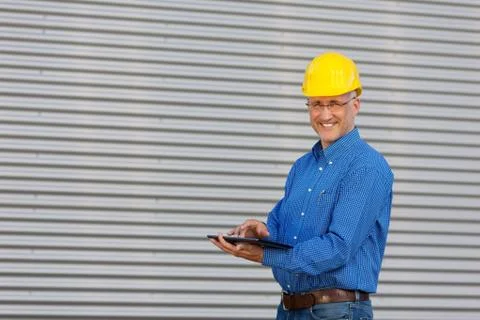 Mature architect using digital tablet Stock Photos