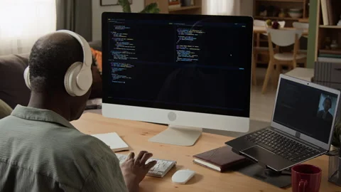 Mature Black Man Programming on Computer in Home Office Video stock 347656643