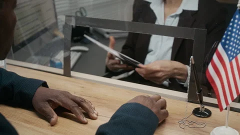 Mature Black Man Submitting Documents for American Visa at Consulate Stock Footage 331512598