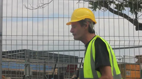 Mature Builder on site talking Video stock 25169726