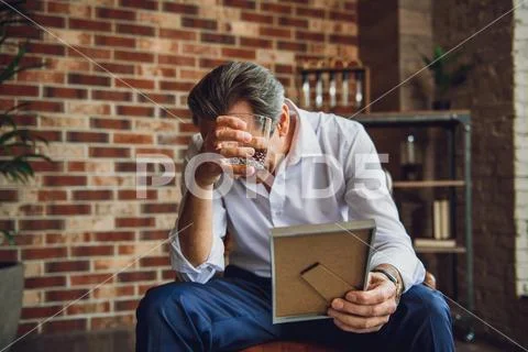 Mature businessman in deep desperation Stock Photos