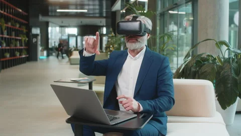 Mature businessman software developer using headset app making presentation in 스톡 동영상 311264092