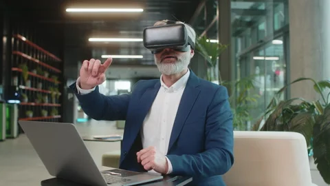 Mature businessman software developer using headset app making presentation in Stock Footage 315865544