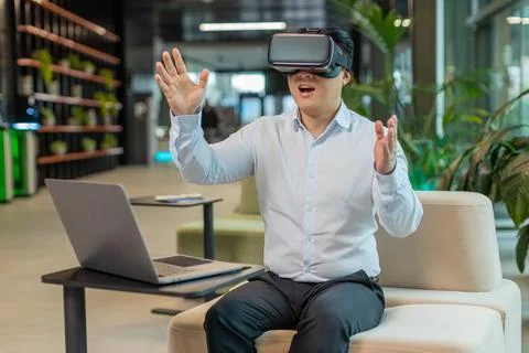 Mature businessman software developer using headset app making presentation in Stock Photos