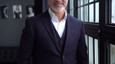 Mature businessman thinks about future projects while standing near window. Stock Footage 140643658