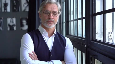 Mature businessman thinks about future projects while standing near window. Stock Footage 140643856
