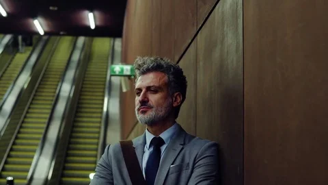 Mature businessman waiting on a metro station. Stock Footage
