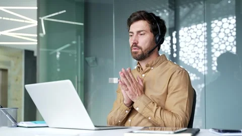 Mature businessman wearing a headset while leading an online business training  Stock Footage 342013947