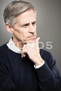 Mature caucasian man with his eyes closed portrait Stock Photos