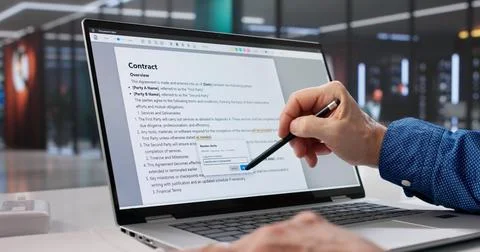 Mature Caucasian Man Proofreading Document On Laptop For Editing Mistakes. Stock Photos