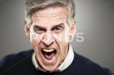Mature caucasian man screaming with rage Stock Photos