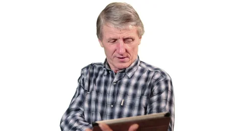 Mature Caucasian man talking while using tablet pc. White isolated background Stock Footage 46428993