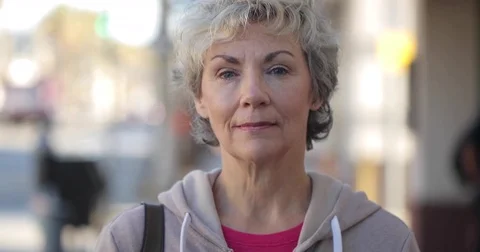 Mature caucasian woman serious angry face portrait on street Stock Footage