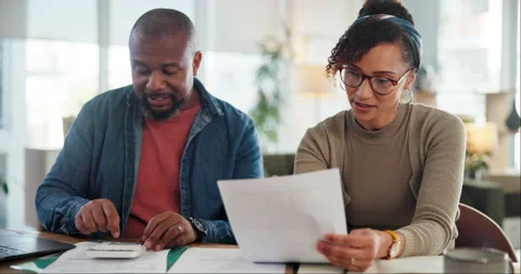 Mature couple, documents and calculator in home for finance, budget or tax Stock Footage 283638159