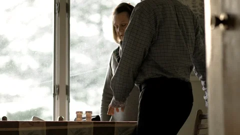 Mature couple sitting down at the dining table. Stock Footage 88374669