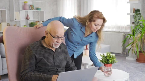 Mature couple on sofa at home using computer, daily life. Stock Footage 219690651
