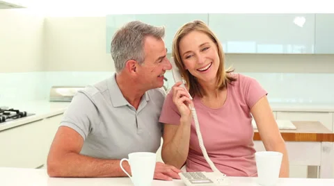 Mature couple talking on the phone Stock Footage 34682215