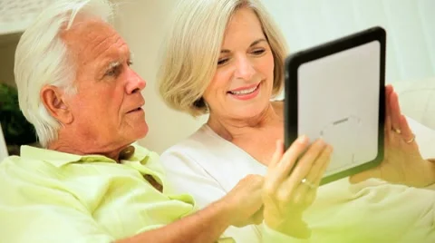 Mature Couple Using Wireless Tablet Stock Footage 7900712