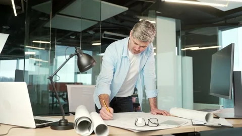 Mature creative designer, architect working in the office at work a computer  Stock Footage 196997874