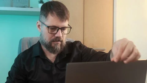 Mature developer serious man is using laptop typing in office 動画素材 237078825