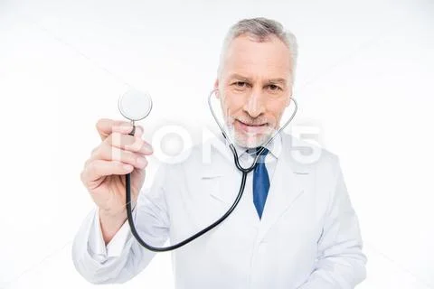 Mature doctor with stethoscope Stock Photos