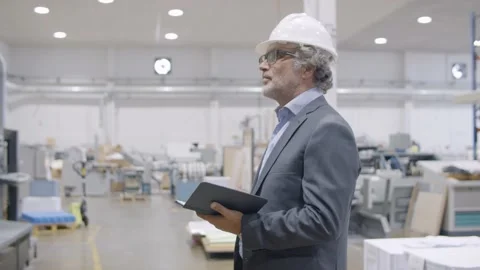 Mature engineer checking factory Stock Footage 147501474