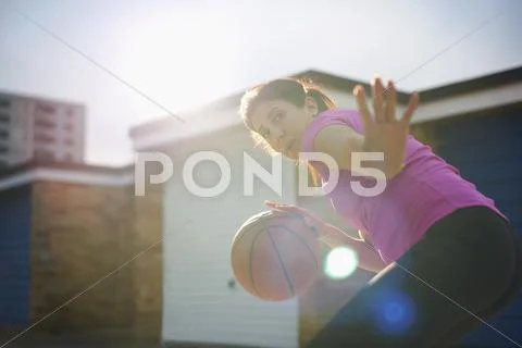 Mature Female Basketball Player Practicing Defense