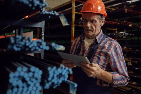 Mature foreman using tablet pc 스톡 사진