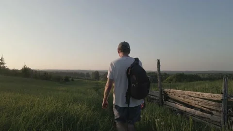Mature Hiker Along a Sunset Path Stock Footage