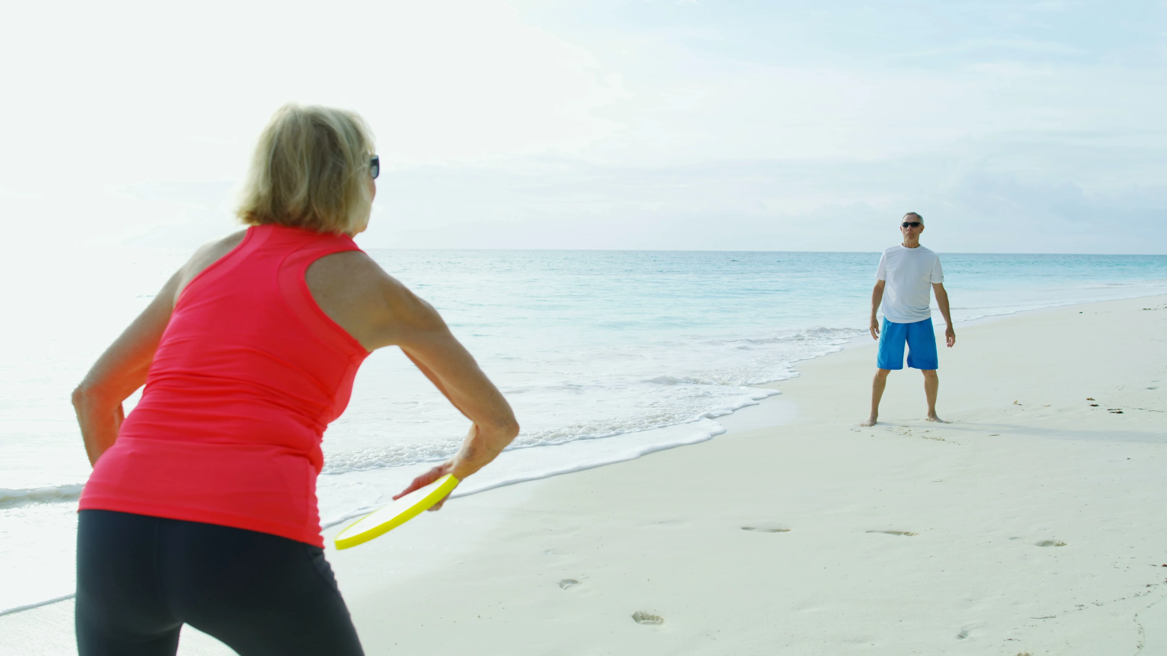 Mature husband wife enjoying retirement on Bahamas beach