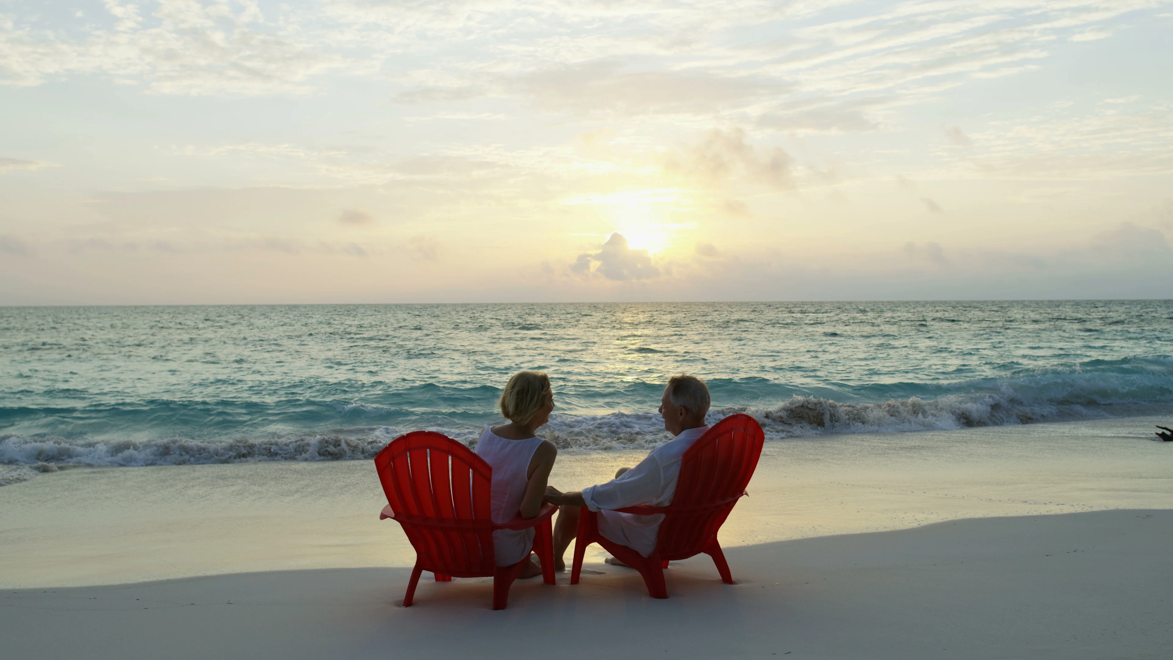 Mature husband wife outdoors at sunset enjoying Bahamas pic