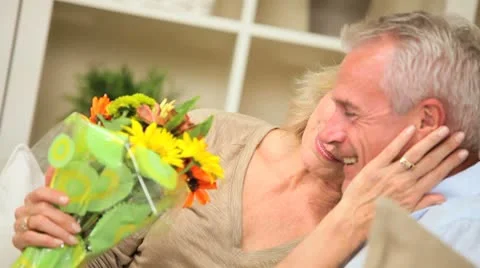 Mature Lady with Flowers from Husband Stock Footage