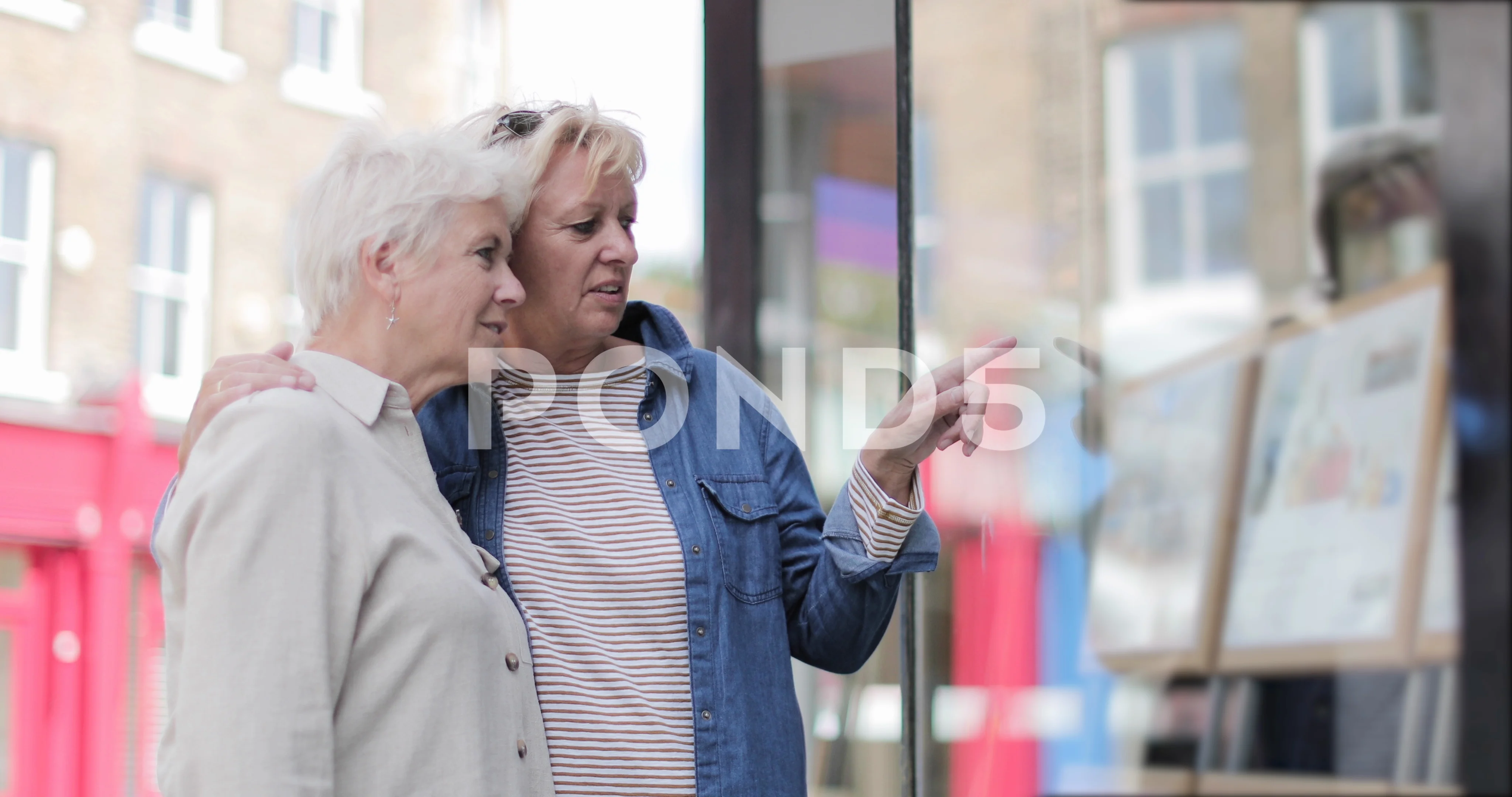 Mature lesbian couple looking at real es... | Stock Video | Pond5