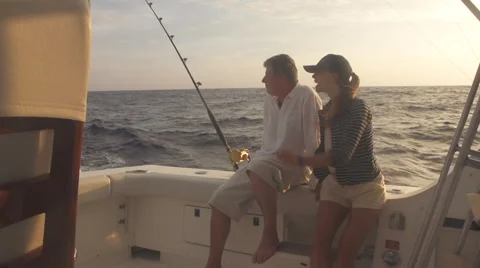 Mature Man And Young Woman On Boat Big Game Fishing Stock Footage
