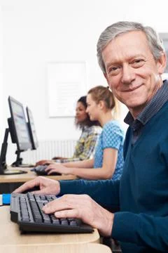 Mature Man Attending Computer Class Stock Photos