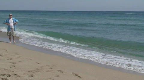 Mature man at the beach Stock Footage 658810