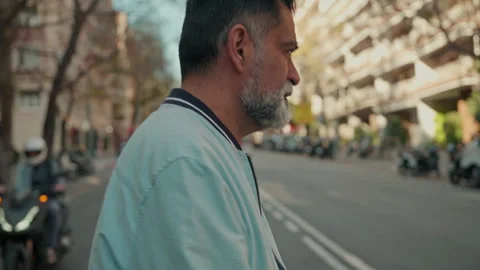 Mature Man With Beard Walking Down City Street Stock Footage 329933698