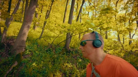 Mature man breathing deeply in forest, mental health relief, active senior in 스톡 동영상 334090568