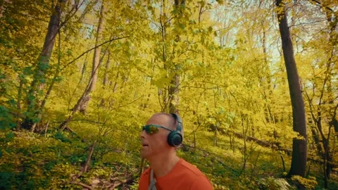 Mature man breathing deeply in forest, mental health relief, active senior in 스톡 동영상 334090785