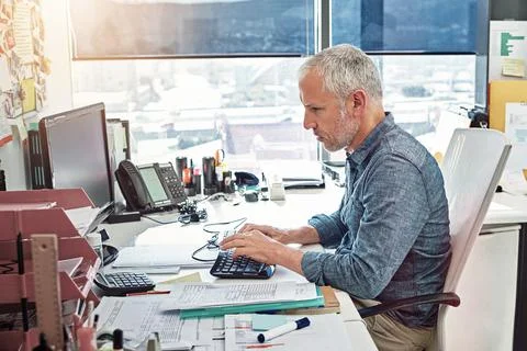 Mature man, computer and documents in office with typing for admin, review and Stock Photos