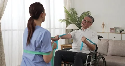 Mature man does resistance exercise on wheelchair 動画素材 220020230