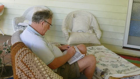 Mature Man Doing A Crossword Stock-Footage 77273287