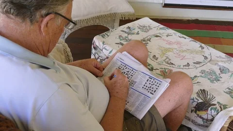 Mature Man Doing A Crossword Stock Footage 77391845