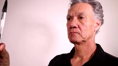 Mature man doing eye exercises Stock Footage 219642676