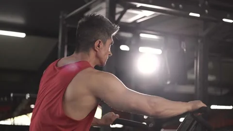 Mature man Doing Intense Workout On Gym Bike Stock Footage 201403595