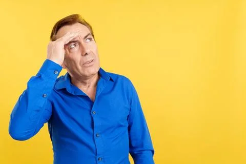 Mature man gesturing that he is forgetting something Stock Photos