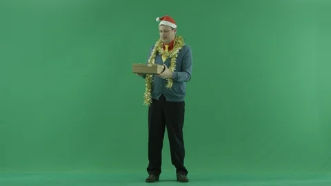 Mature man got empty Christmas gift, green chroma key background Stock Footage 86671233