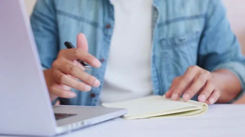 Mature man hands typing on notebook keyboard in slow motion. Closeup unrecogn Stock Footage 154651993