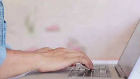 Mature man hands typing on notebook keyboard in slow motion. Closeup unrecogn Stock Footage 154652180